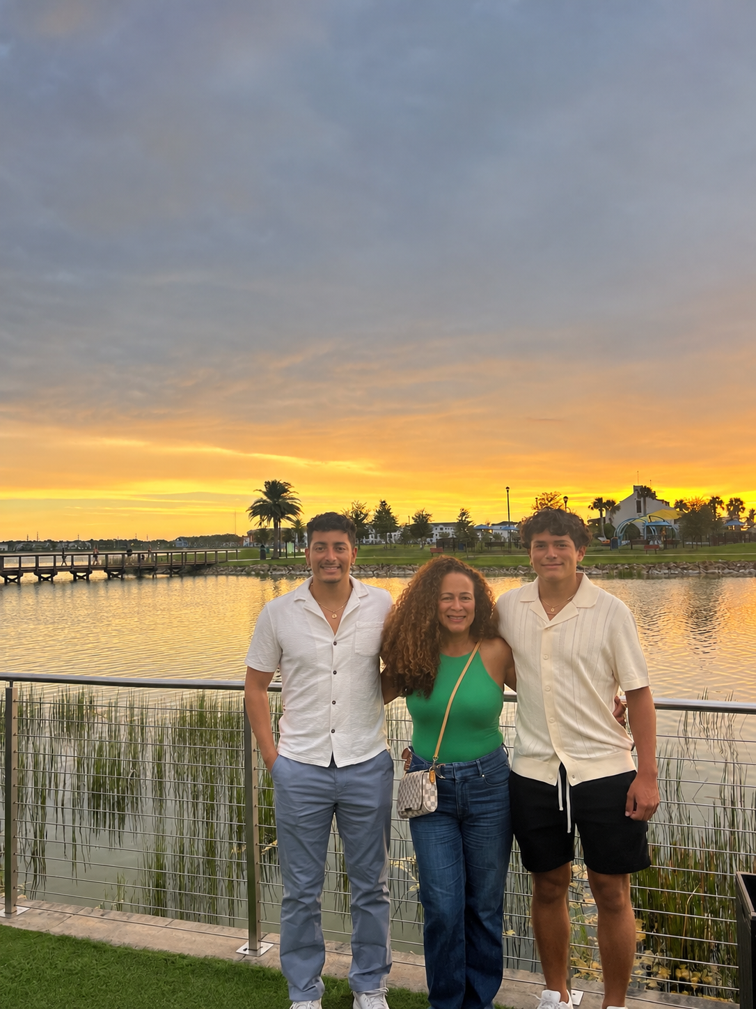 The Rincon family by the waterfront at sunset